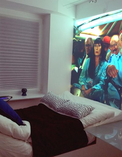 film projected on the wall by the bed in wro.place